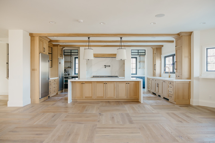 custom kitchen with wood cabinets and wood ceiling beams in Utah County, Utah by 10X Builders