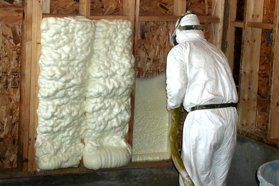 spray foam insultion with man in white biohazard suit - photo by best consumer reviews