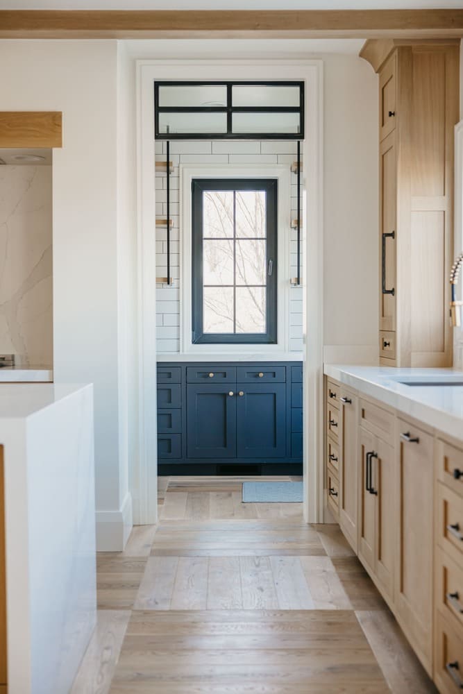 kitchen with blue cabinets by 10x builders in utah county