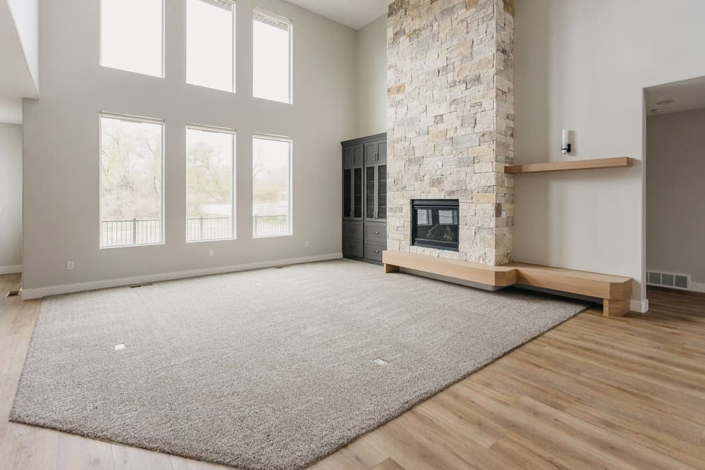 living room with light carpet and large windows by 10x builders in utah county