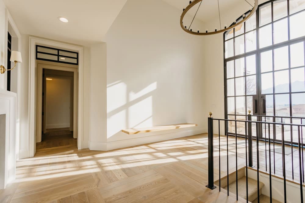 grand hallway with floor-to-ceiling windows by 10x builders in utah county