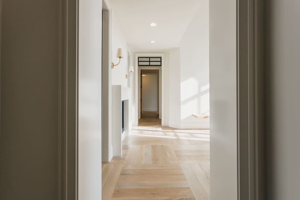 hallway with open door at the end by 10x builders in utah county